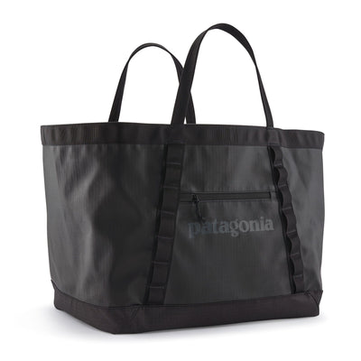 Black tote bag with Patagonia logo on a white background