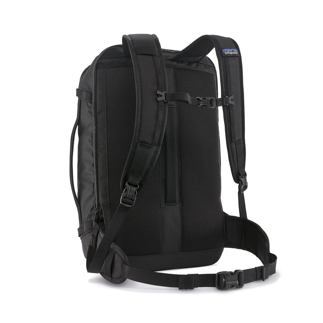 Patagonia Black Hole Mini MLC 30L Black — back view with padded straps, sternum strap, and hip belt