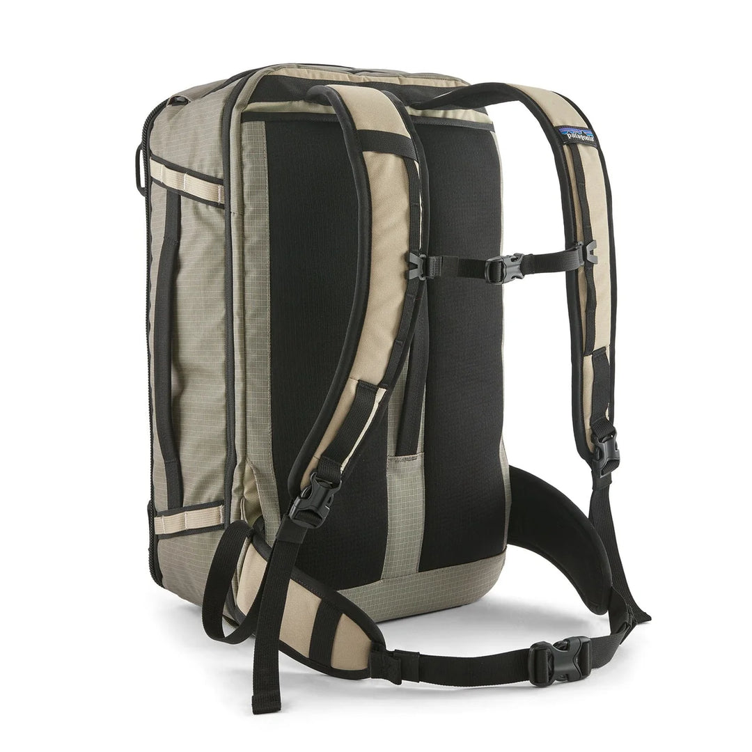 Black Hole Mini MLC 30L Weathered Stone — back three-quarter view with padded straps and hip belt