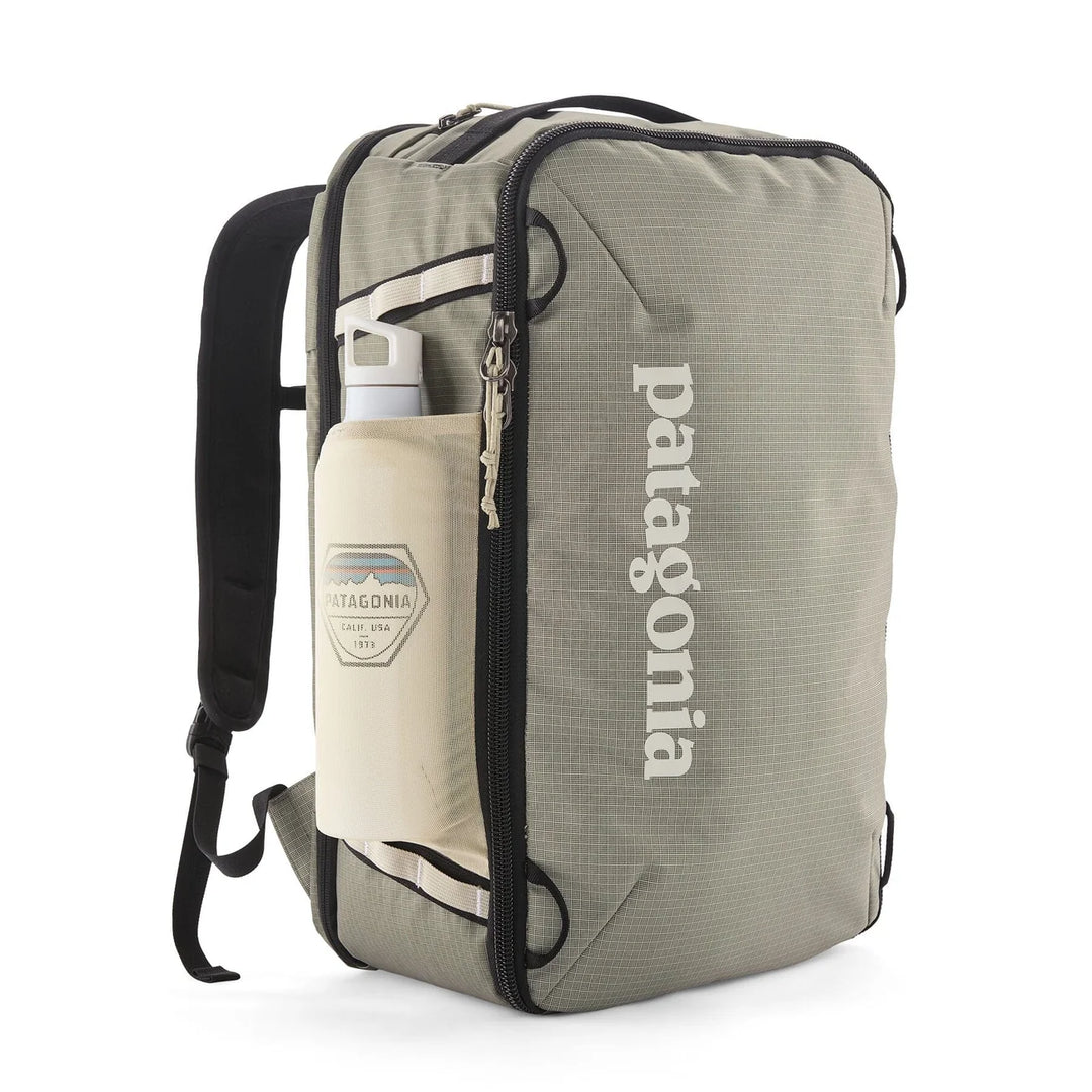 Black Hole Mini MLC 30L Weathered Stone with water bottle in the side stretch pocket