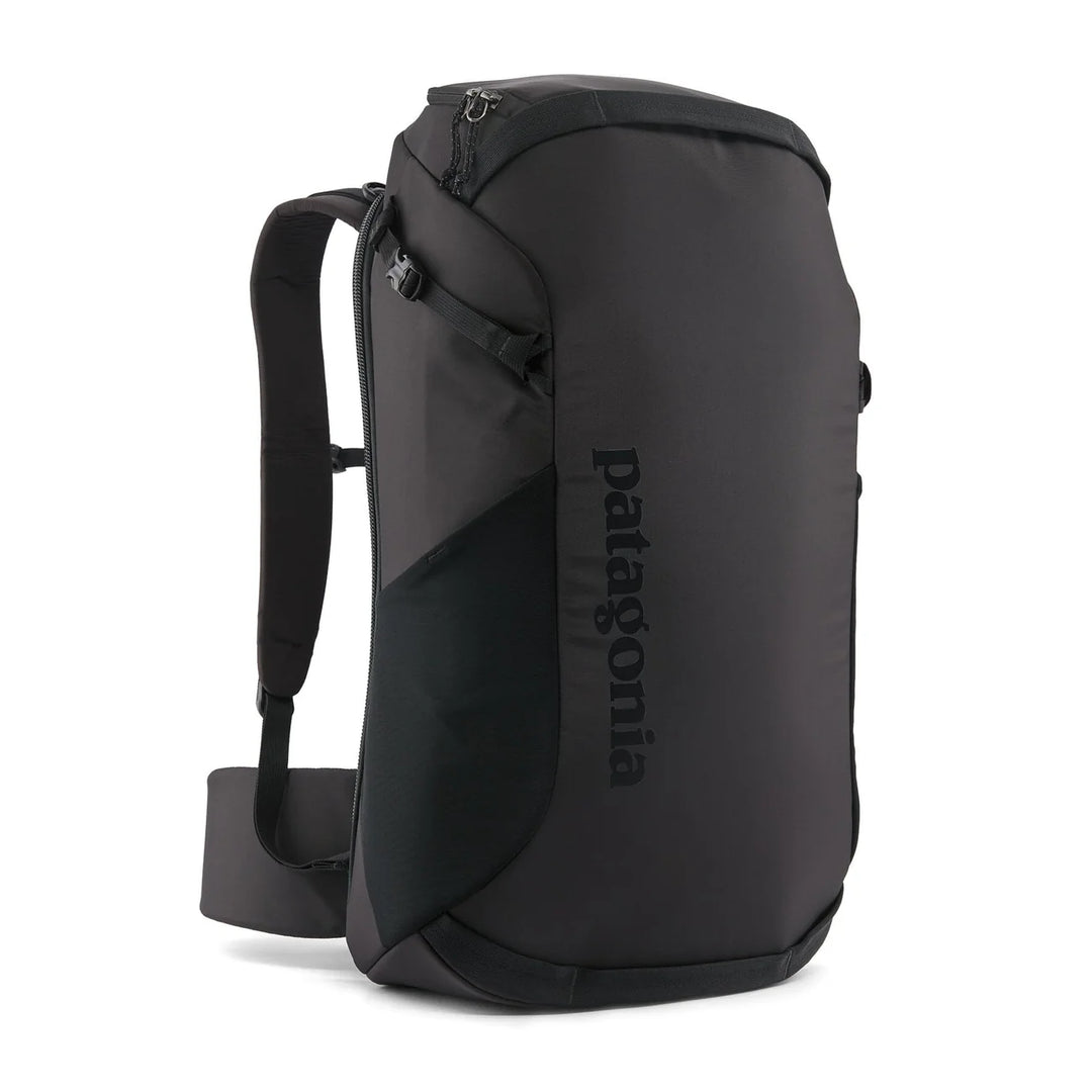 Patagonia Cragsmith Pack 32L Black — three-quarter view with roll-top closure and tonal logo