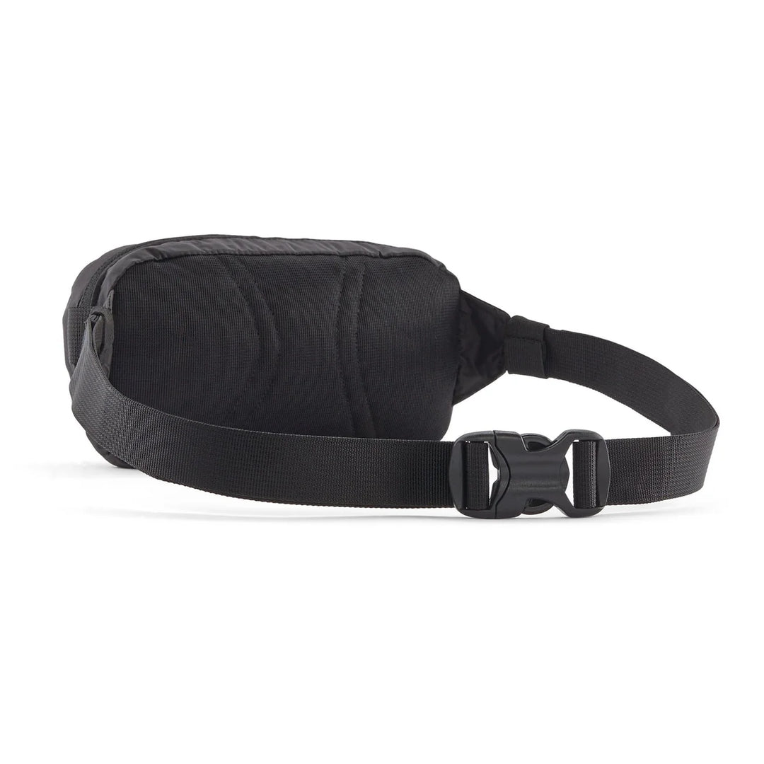Patagonia Terravia Mini Hip Pack Black — back view with quilted padding and adjustable strap