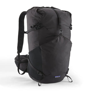 Patagonia Terravia Pack 36L Black — front view with top-loading roll closure and compression straps