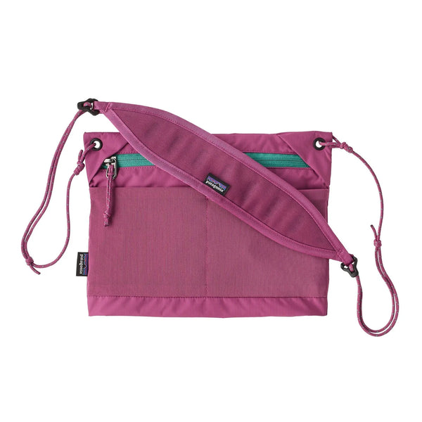 Patagonia Terravia Sacoche Bag 3L Flame Dark Magenta — front view with zip pocket and adjustable cord strap