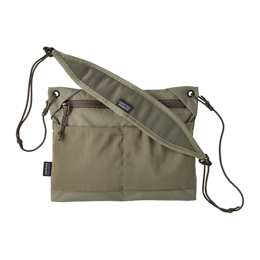 Patagonia Terravia Sacoche Bag 3L River Rock Green — front view with zip pocket and cord strap