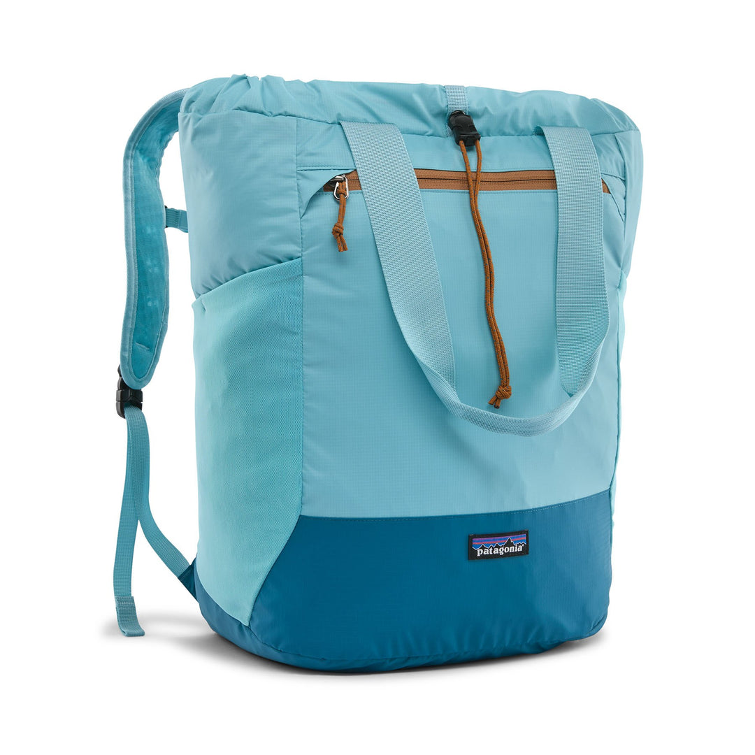 Patagonia Terravia Tote Pack 24L in Snowmelt Blue — front view with tote handles and orange zip pull