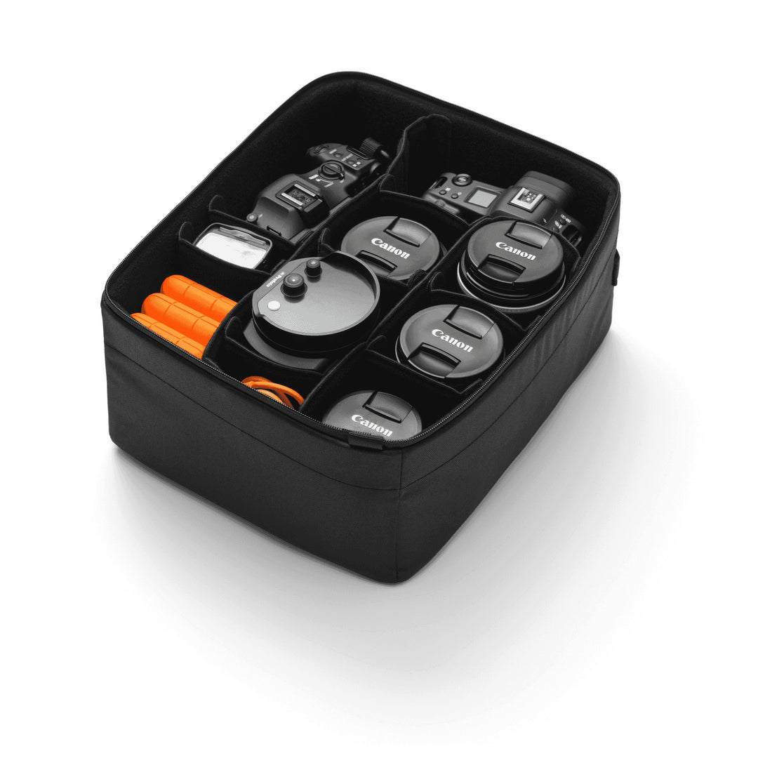 Ramverk Camera Insert L, open with camera bodies and lenses held by the dividers
