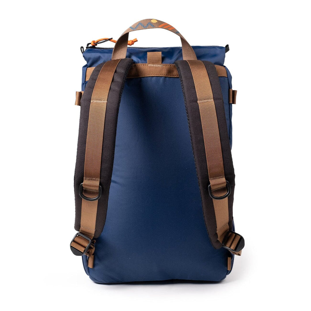 Rear view of the Rover Pack Classic in midnight navy — padded shoulder straps with brown webbing