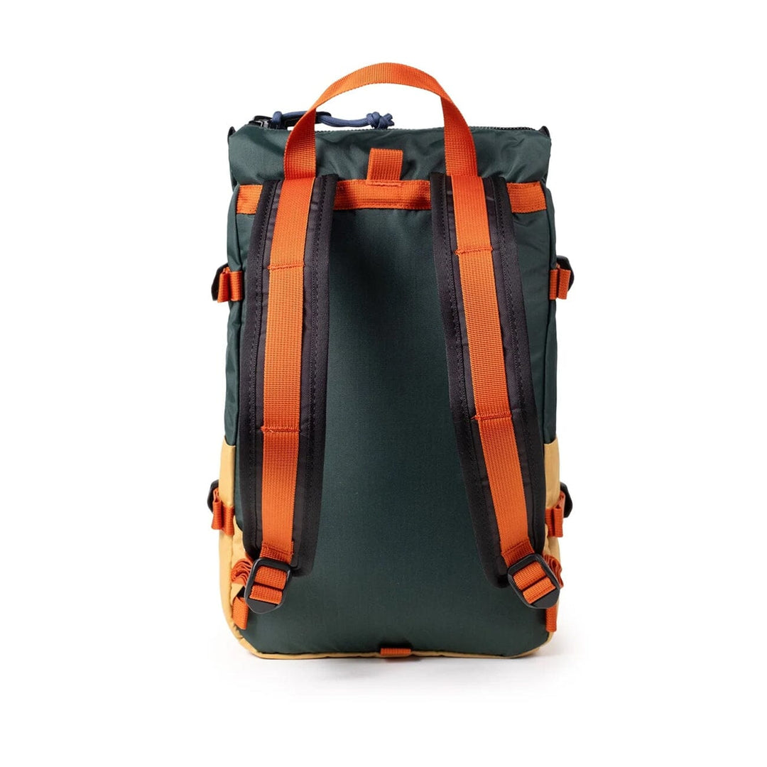 Rear view of the Rover Pack Mini in forest and goldenrod — green back panel and orange shoulder straps