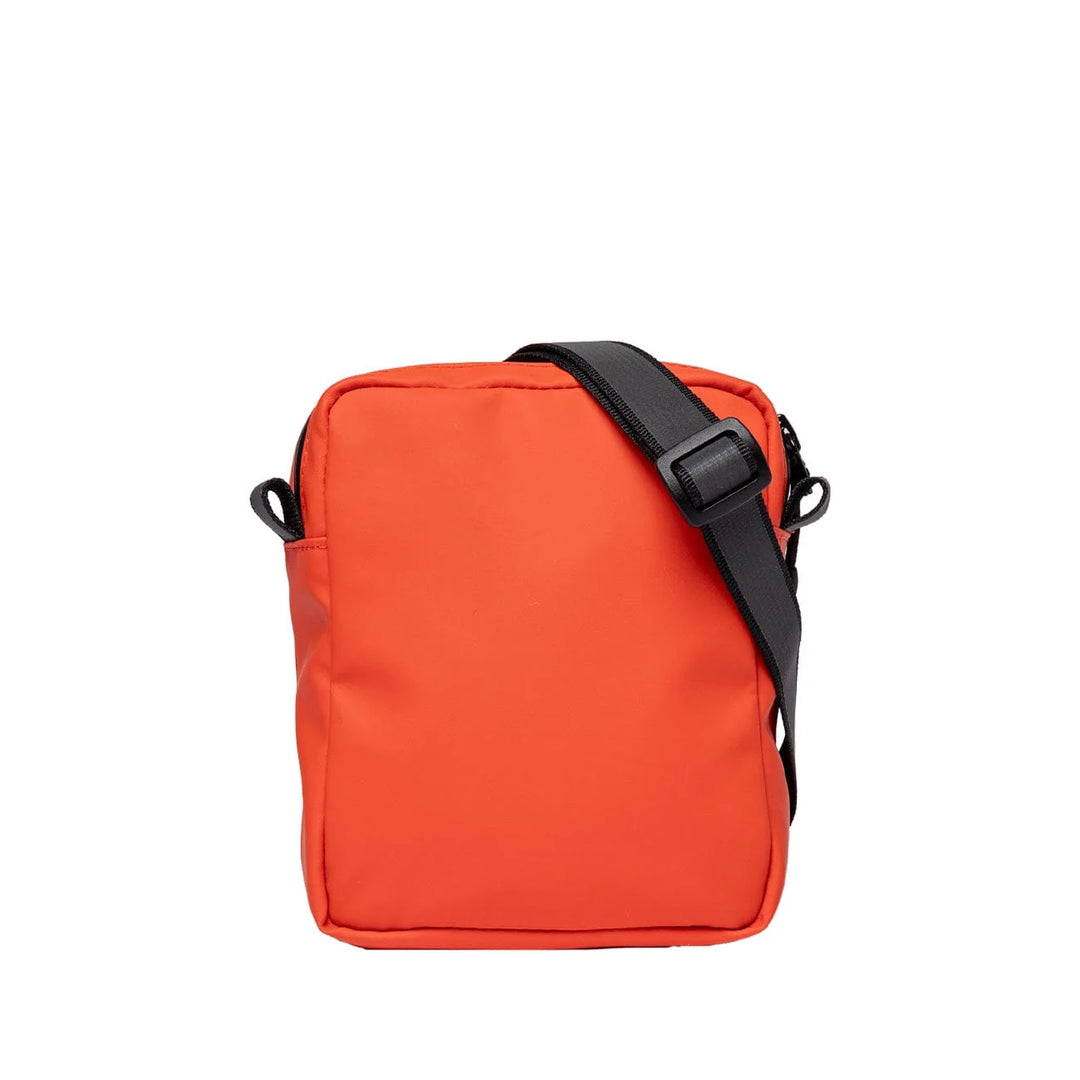 Sandqvist Poe bag in orange, back view showing flat back panel and top zip