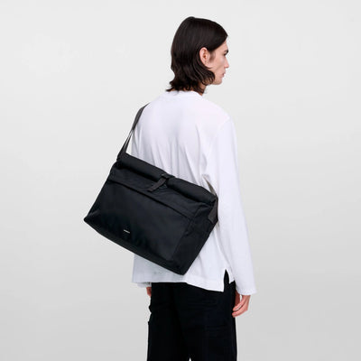 Scandinavian messenger bag highlighting clean lines, sustainable build, and versatile everyday functionality