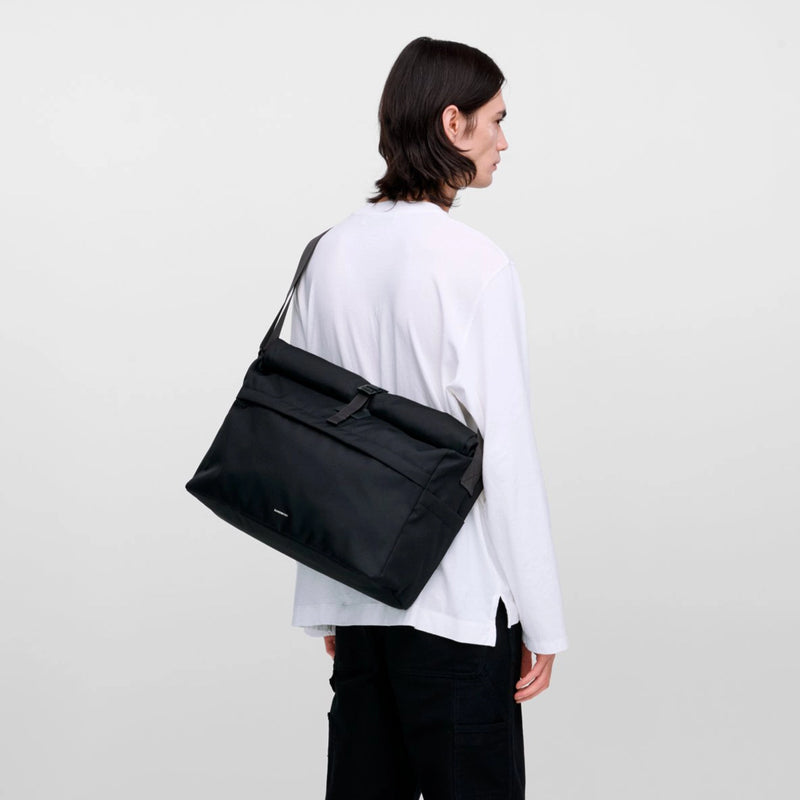 Scandinavian messenger bag highlighting clean lines, sustainable build, and versatile everyday functionality
