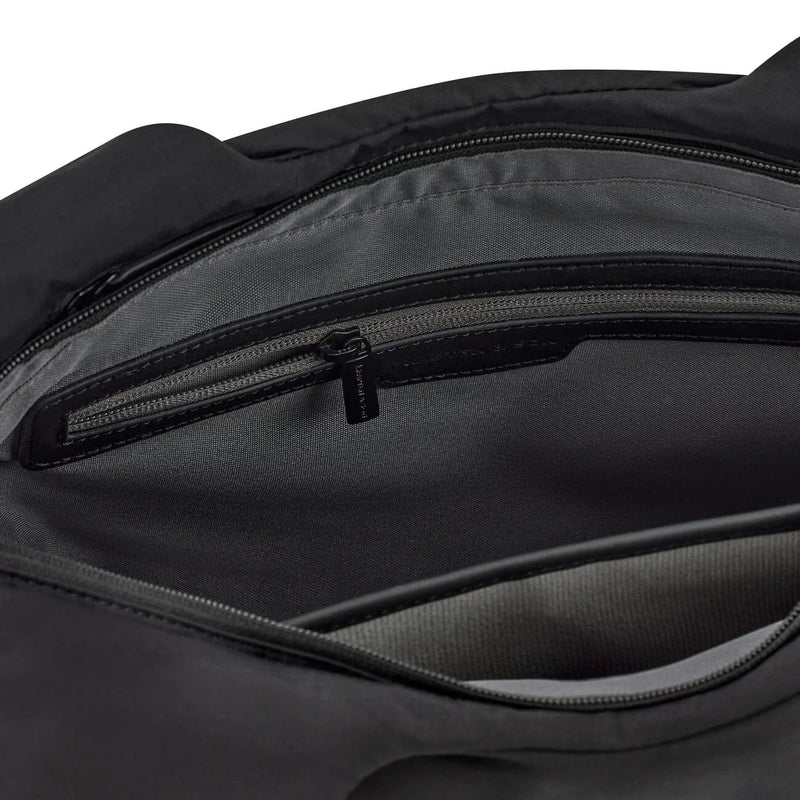 Close-up of the empty internal zip pocket with grey lining