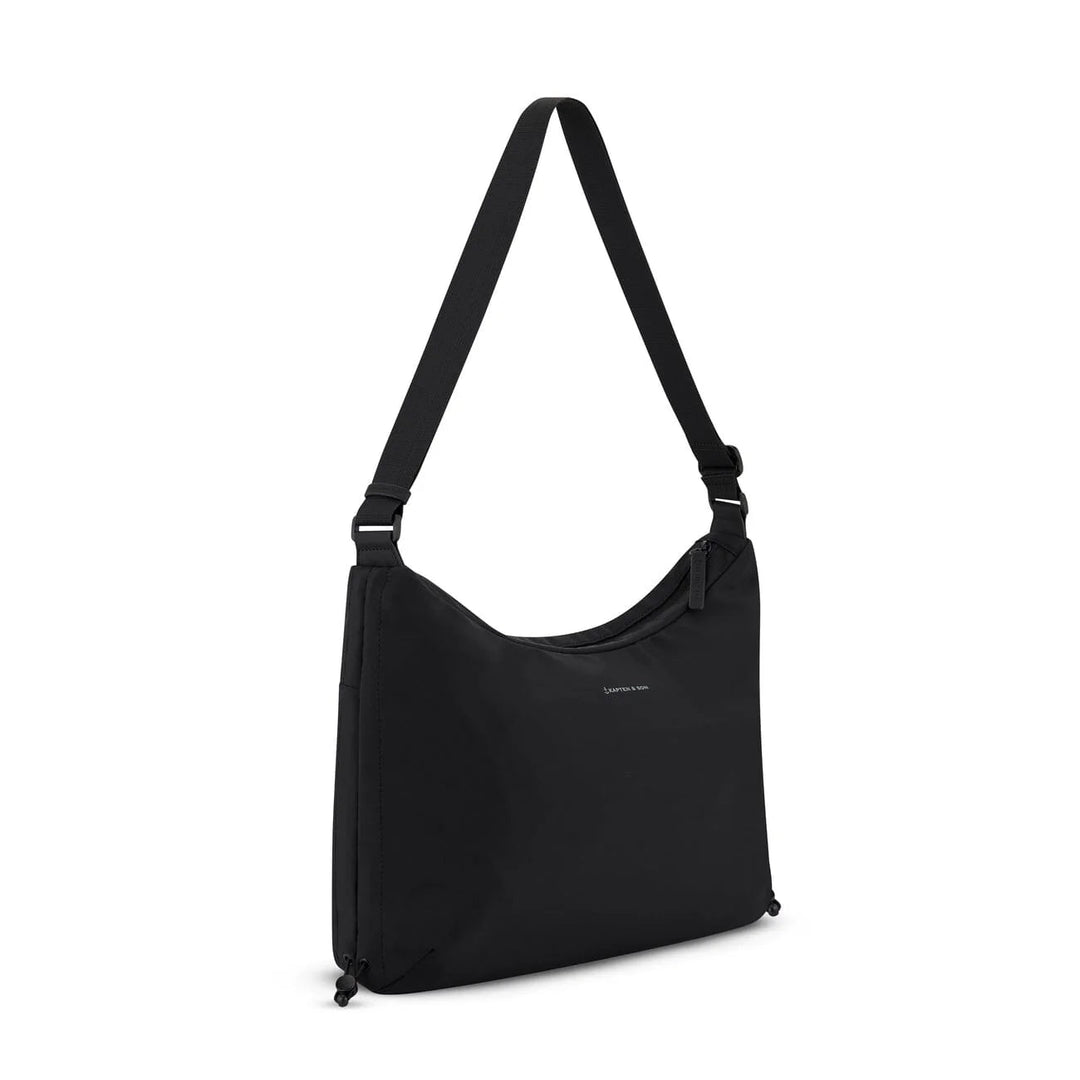 Side angle showing the soft curved shape and webbing strap