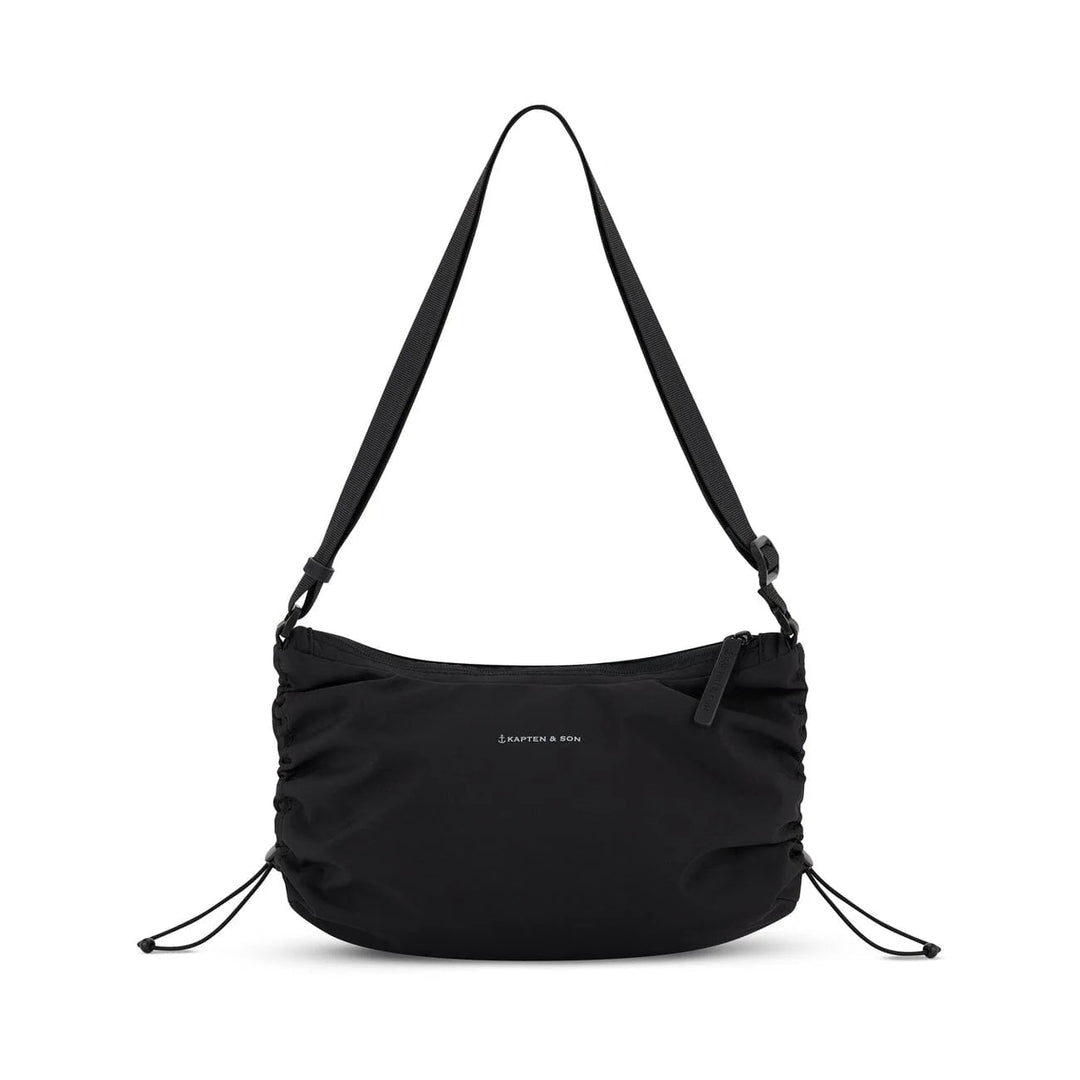 Front view with side drawcords cinched for a compact shape