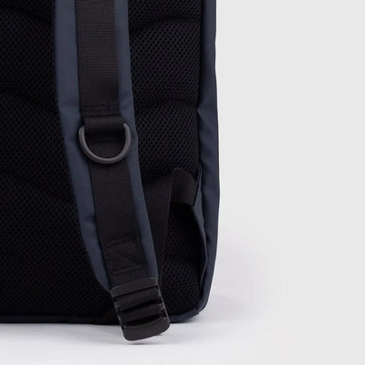 Close-up of the padded back panel and adjustable shoulder strap of the navy waterproof rolltop backpack, designed for comfort and everyday carry