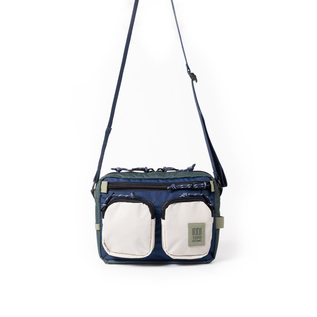 Topo Designs Block Bag 3.5L in Forest and Bone White — front view with twin bone white pockets and crossbody strap