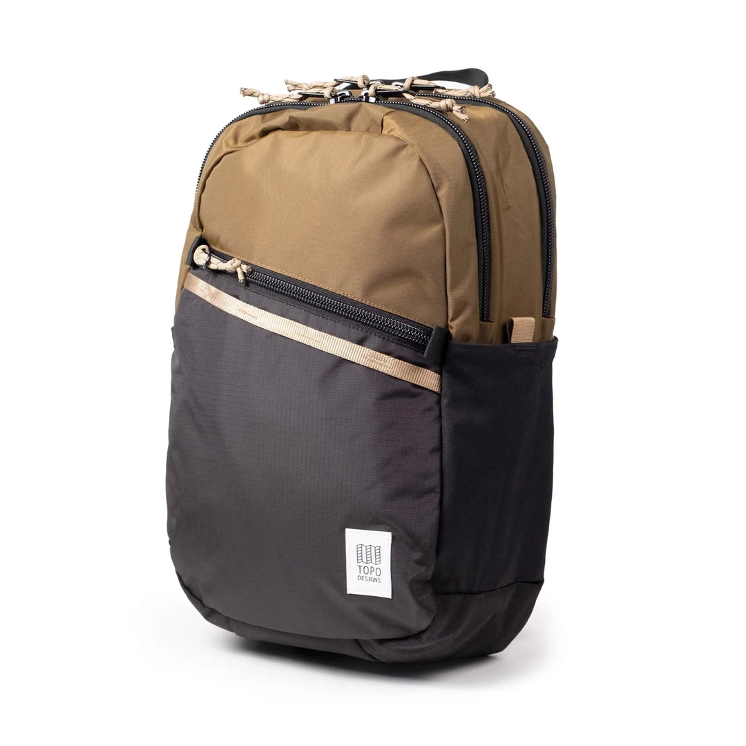 The Commuter Backpack in desert palm and elmwood — three-quarter angle