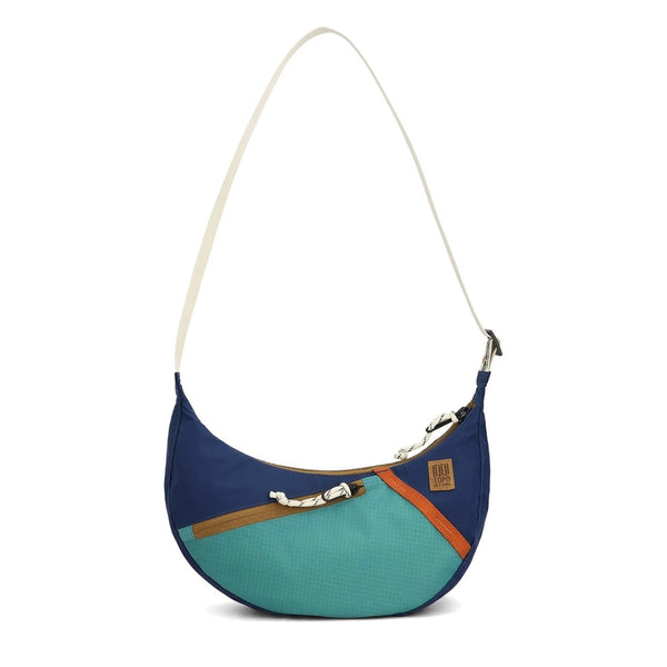 Topo Designs Moonlight Crossbody Bag in midnight and caribbean — front view with navy body and teal accents