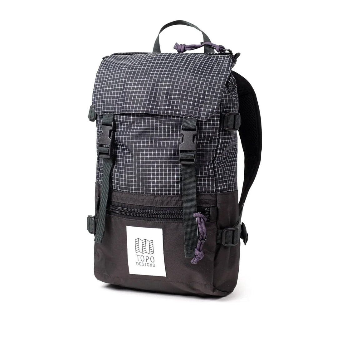 The Rover Pack Mini in black and grid — three-quarter angle showing the X-Pac ripstop top panel