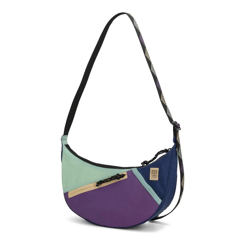 Side angle of the Moonlight crossbody by Topo Designs, outdoor-ready sling in vibrant colors