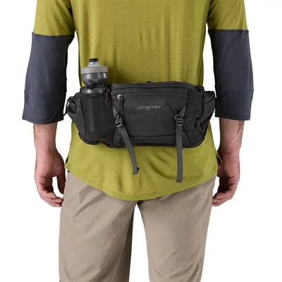 Technical MTB hip pack strapped on during fast descents