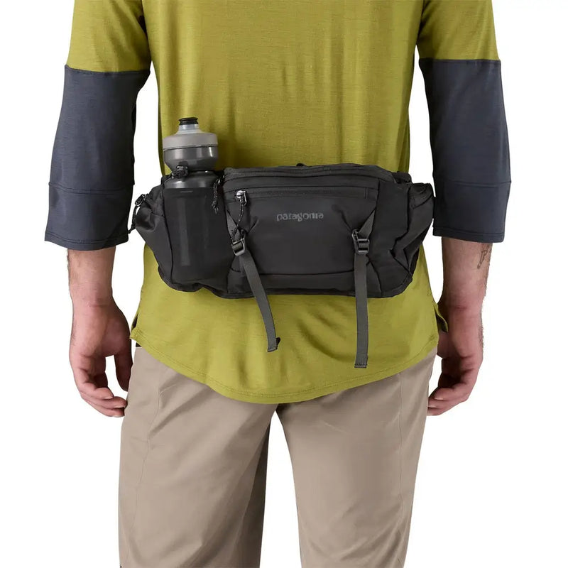 Technical MTB hip pack strapped on during fast descents