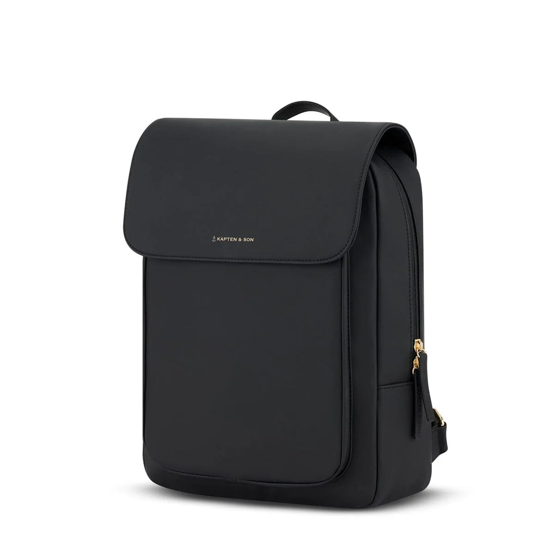 Three-quarter view showing the slim profile, gold side zippers and elegant rectangular silhouette