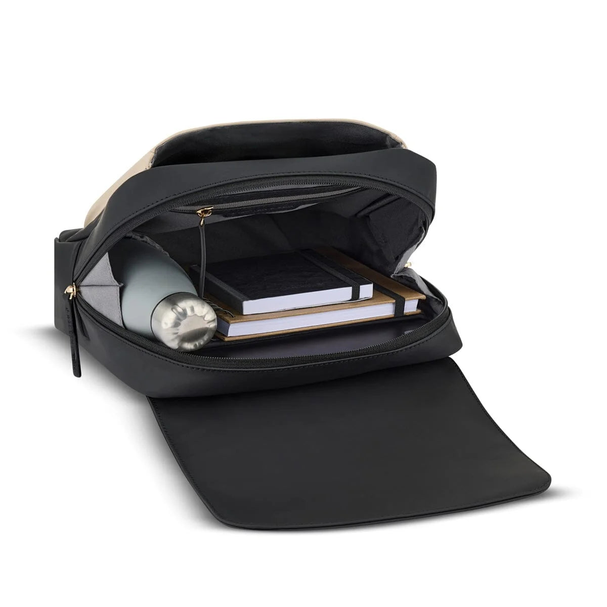 Main compartment packed with everyday items: a water bottle and two notebooks