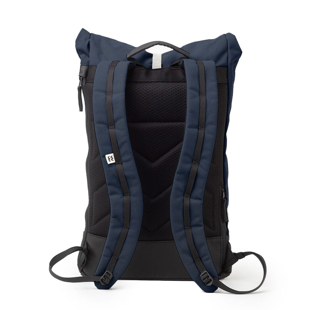 Rear view of the Wanaka Backpack in navy blue with padded shoulder straps