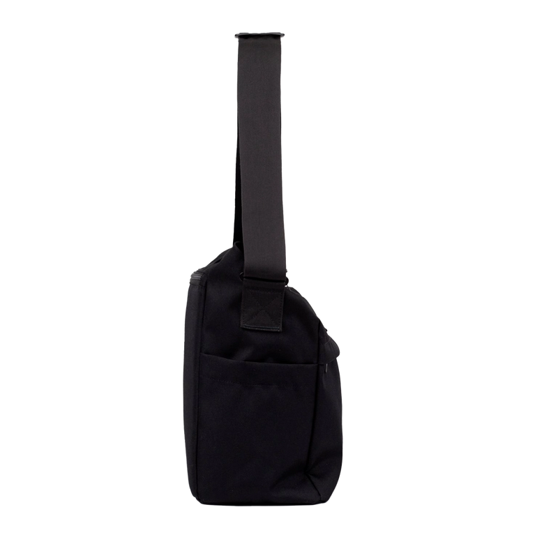 Water-resistant messenger bag with smart compartments, designed for city commuters facing unpredictable weather