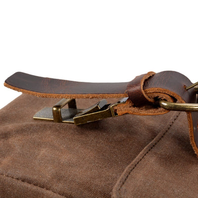 waxed canvas and leather messenger bag secure clip buckle