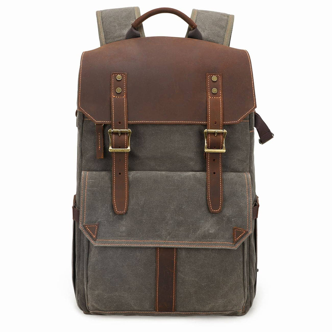 Waxed canvas camera backpack in army green with crazy horse leather flap and twin leather strap closures with brass square buckles — Algonquin