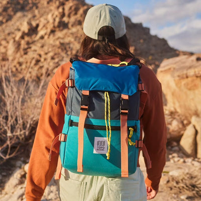 woman hiker wearing topo design rover pack classic rucksack