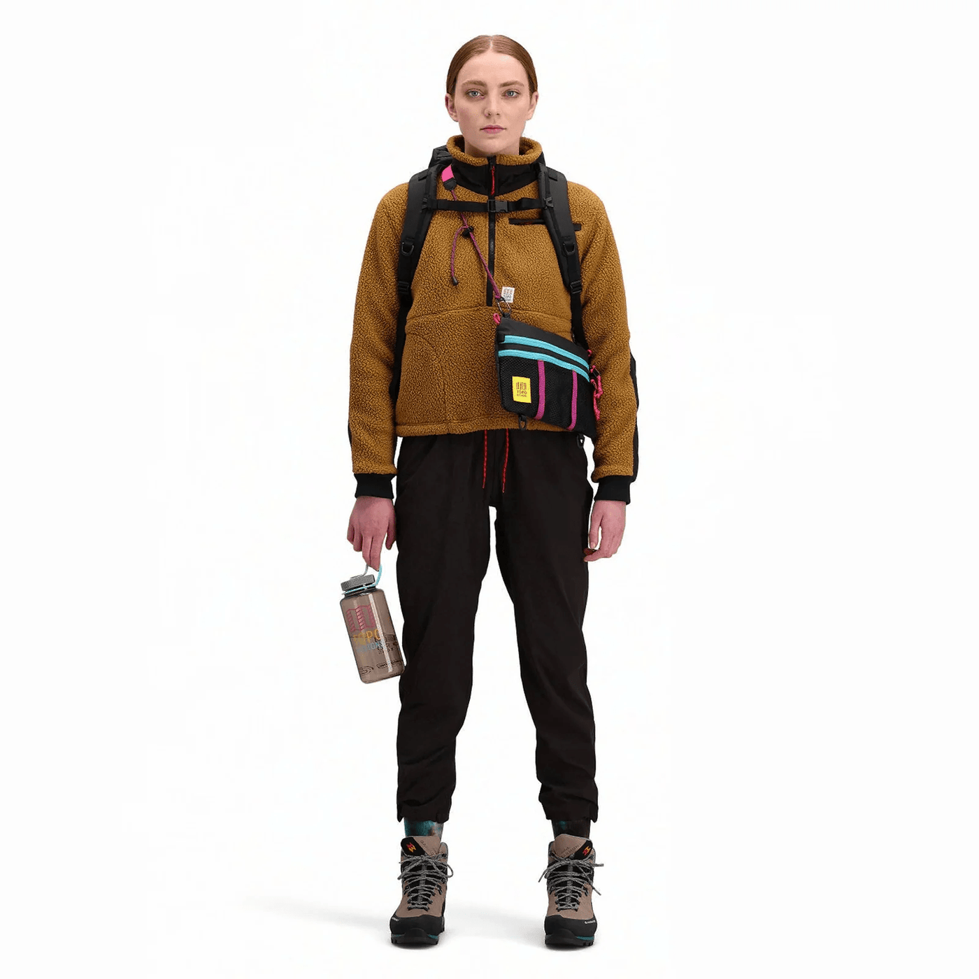 woman hiker wearing topo designs mountain accessory shoulder bag