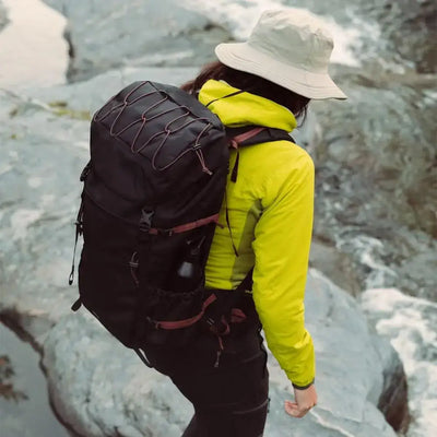 woman hiking wearing sandqvist mountain hike bag black