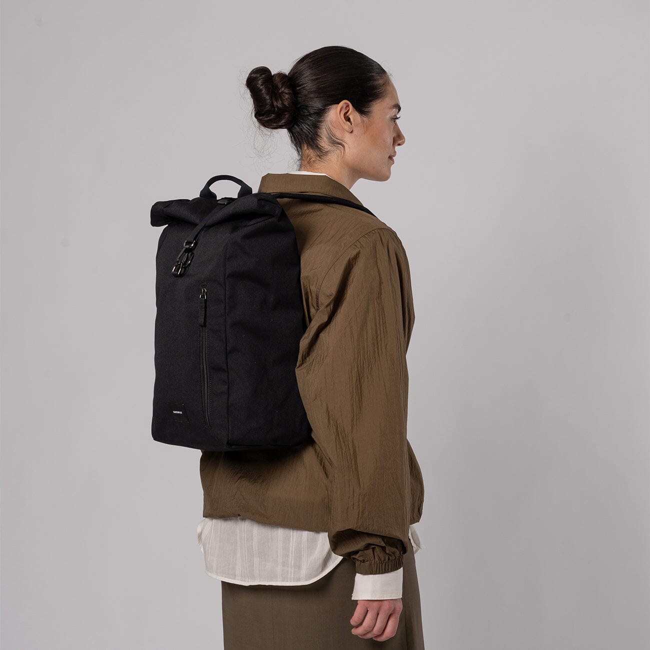 woman wearing dante vegan sandqvist backpack black