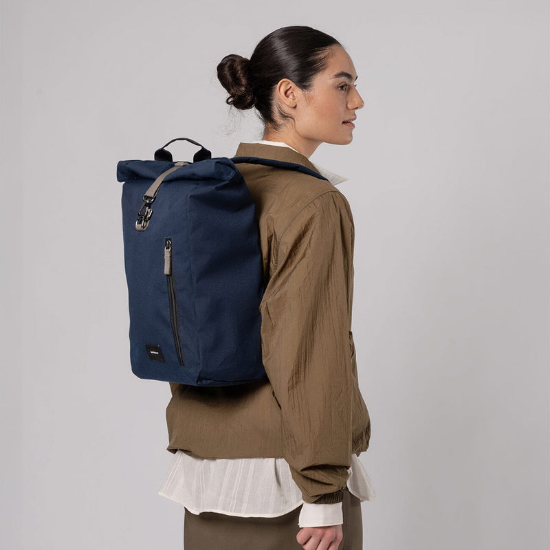 woman wearing dante vegan sandqvist backpack navy blue