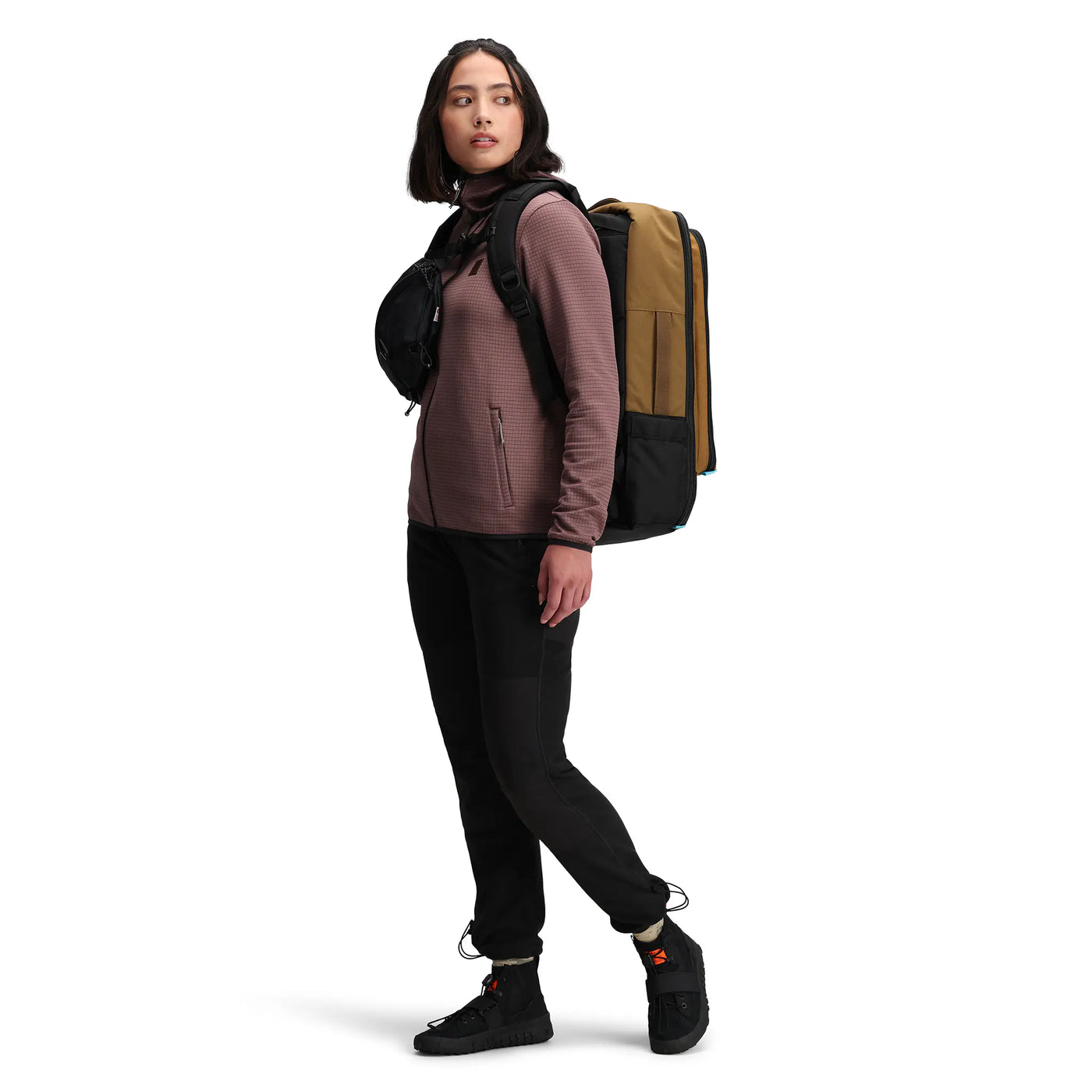 woman wearing global travel bag 40L side