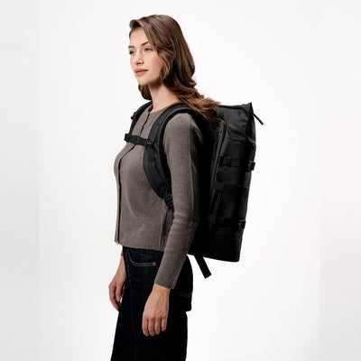 woman wearing kapten and son helsinki pro backpack all black, side view