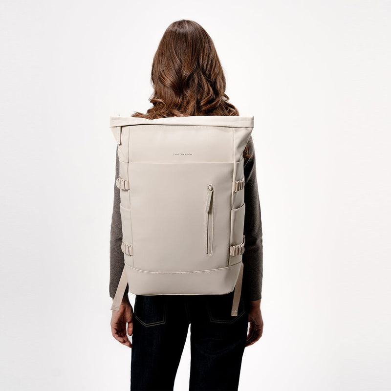 woman wearing kapten and son helsinki pro backpack sandstone, back view