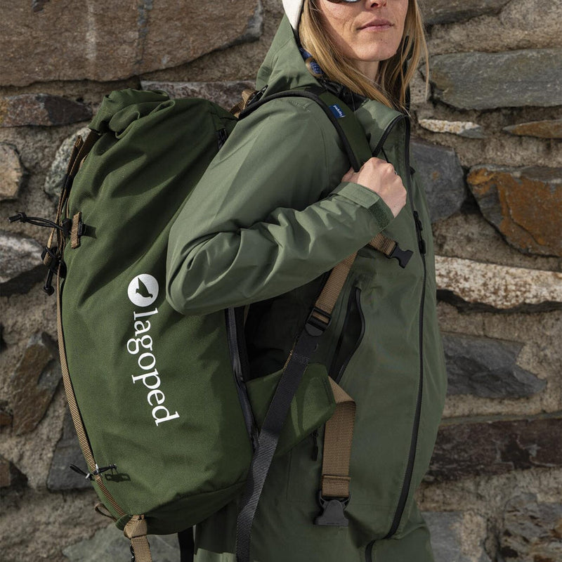 female skier wearing the lagoped kiiruna 2 backpack in thym on a ski touring outing