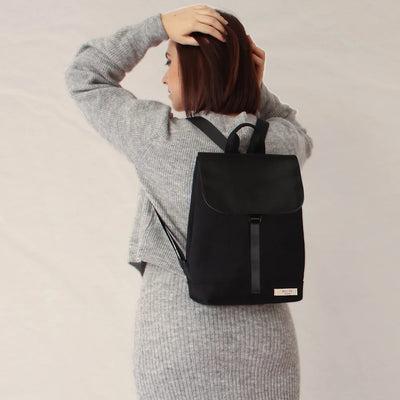 woman wearing mel black backpack reliee studio