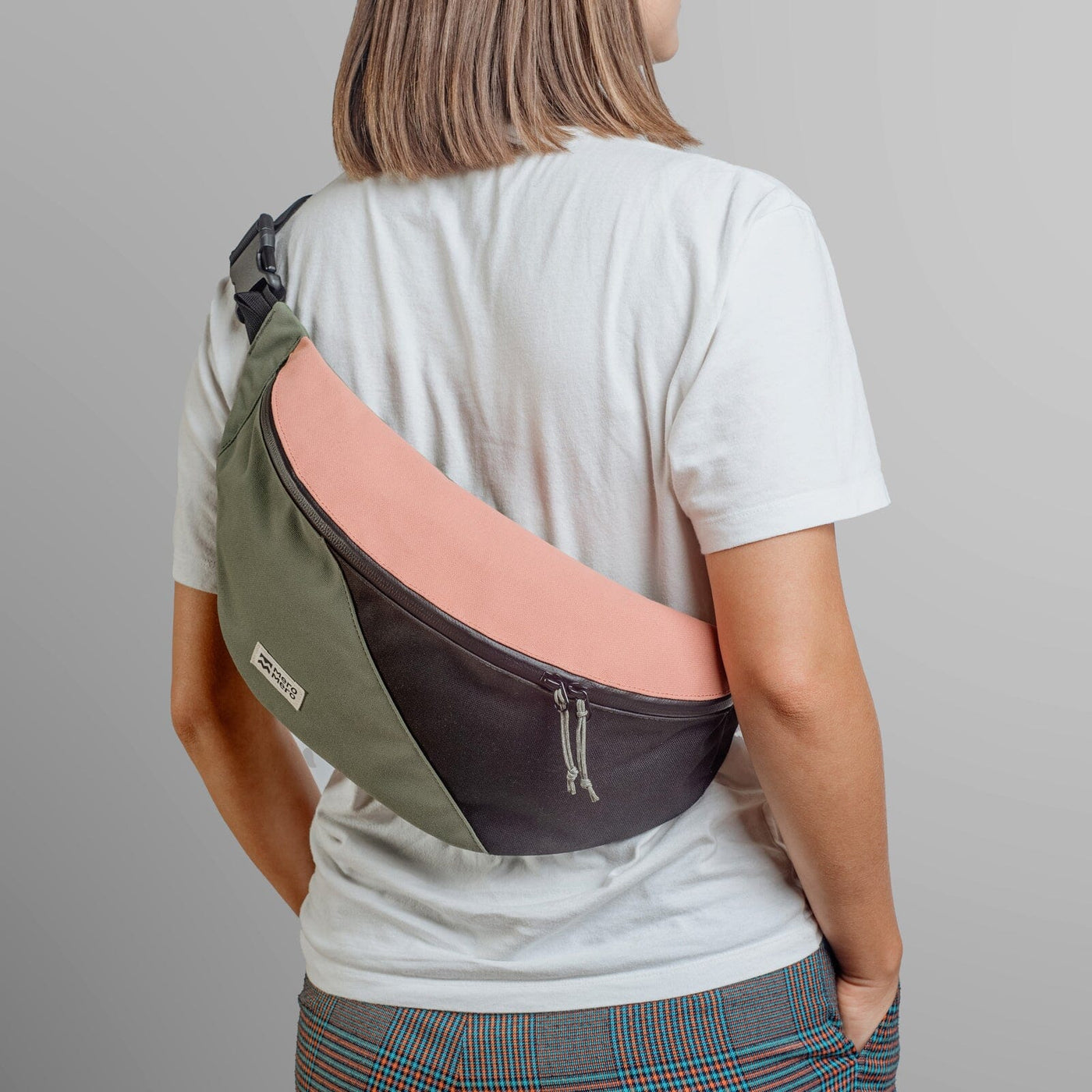 woman wearing mero mero hoian recycled bum bag as sling bag