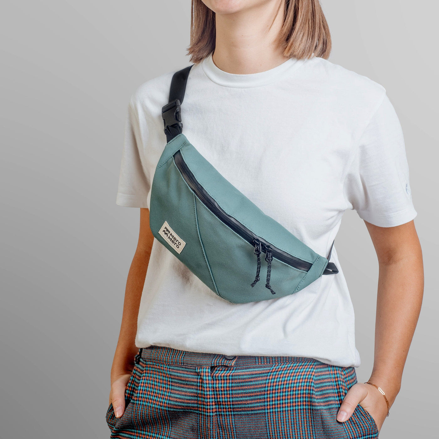 woman wearing mero mero mini hoian small recycled fanny pack as chest bag