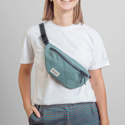 woman wearing mero mero mini hoian small recycled fanny pack as cross body bag