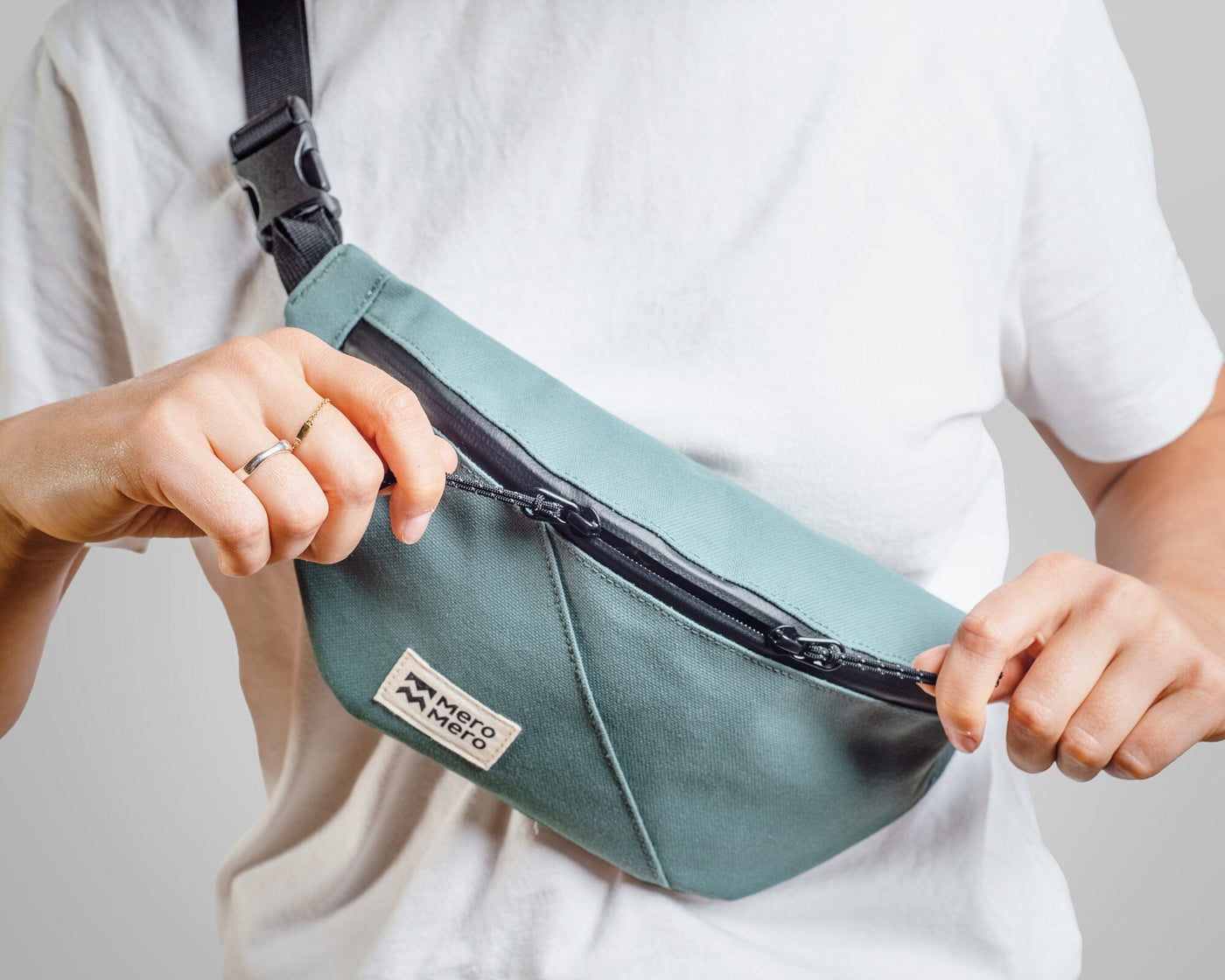 woman wearing mero mero mini hoian small recycled fanny pack as sling bag