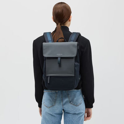 woman wearing midnight blue fyn backpack kapten son back