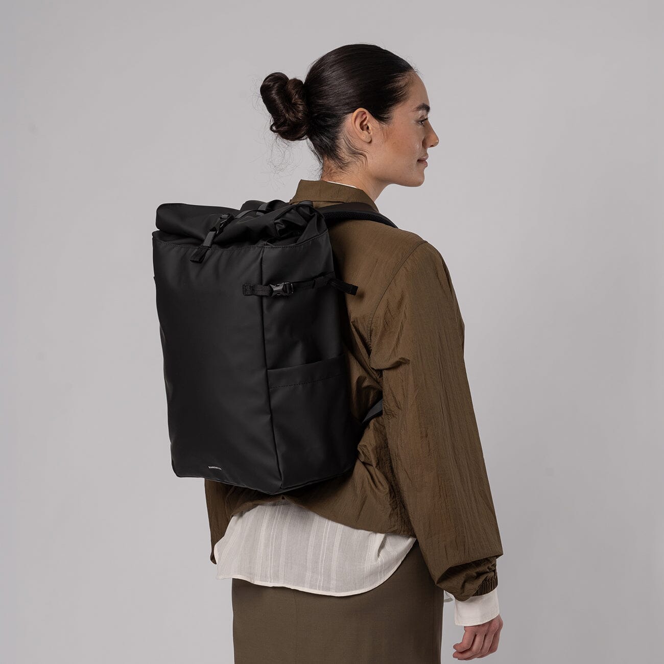 woman wearing sandqvist arnold black backpack lifestyle