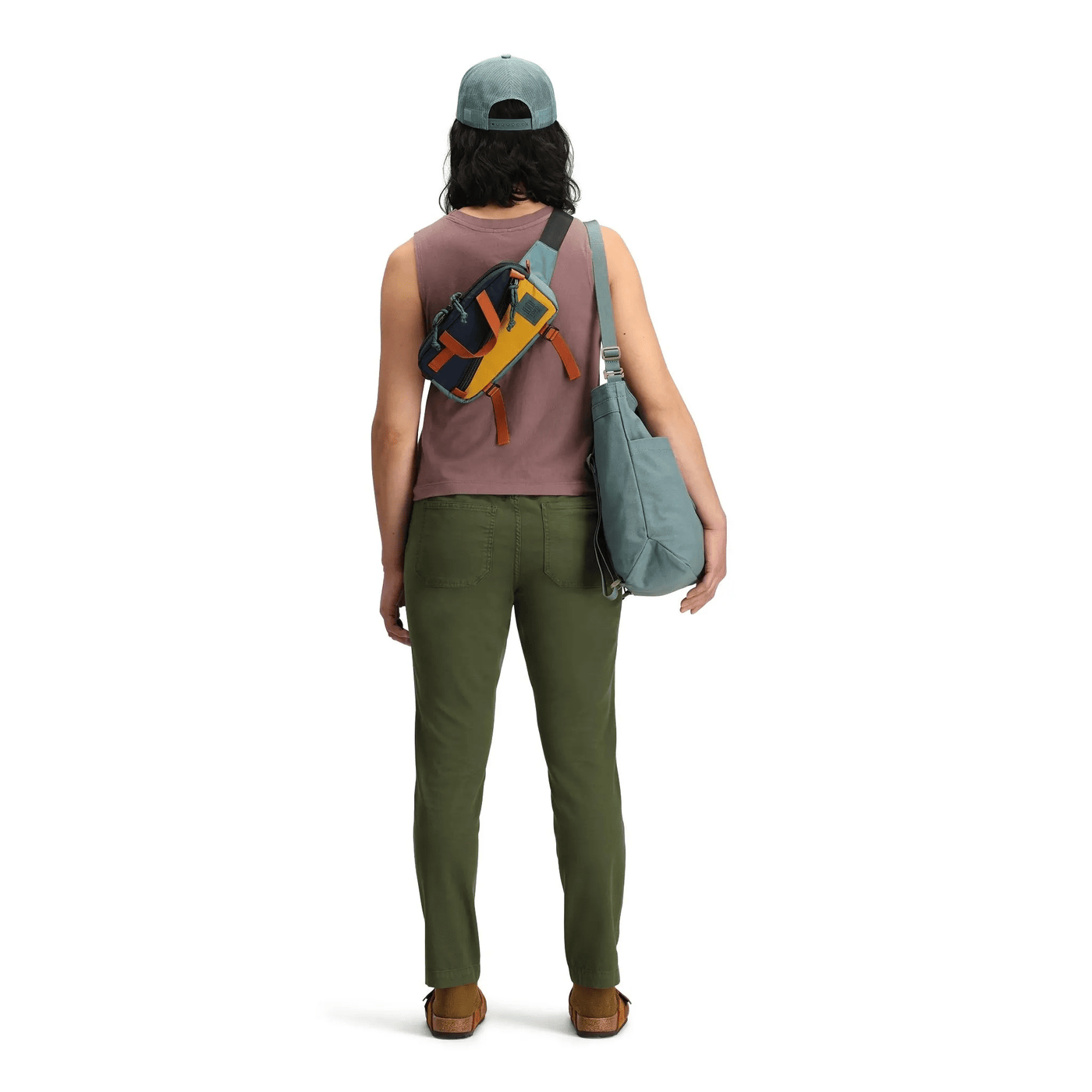 woman wearing topo designs mini quick pack 1.7 L as cross body bag look detail woman